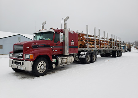 Treeline hauls logs in Chester, ME